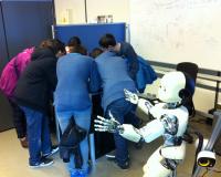 students play hide and seek with a humanoid robot